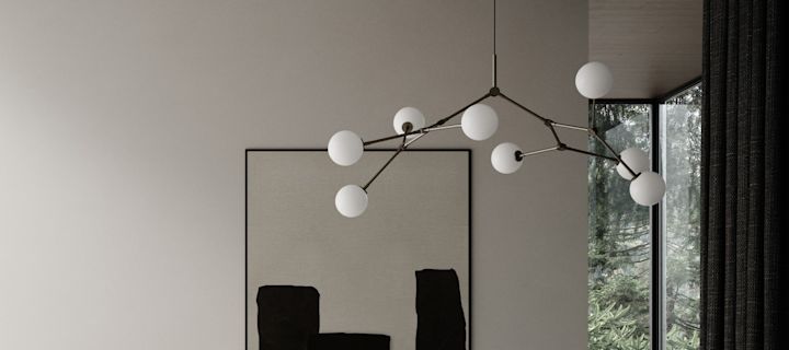 Ljuskronan Drop Bulb från 101 Copenhagen hänger i ett sovrum. 